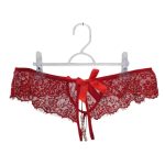 Tanga perlas y moño rojo n